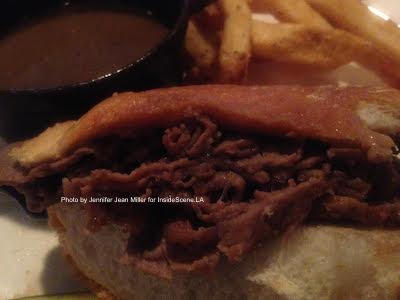 The underside of this French Dip Sandwich, from the HAT Tavern in Summit, NJ, shows how the bread is dipped as part of the sandwich's special touch. Photo by Jennifer Jean Miller.